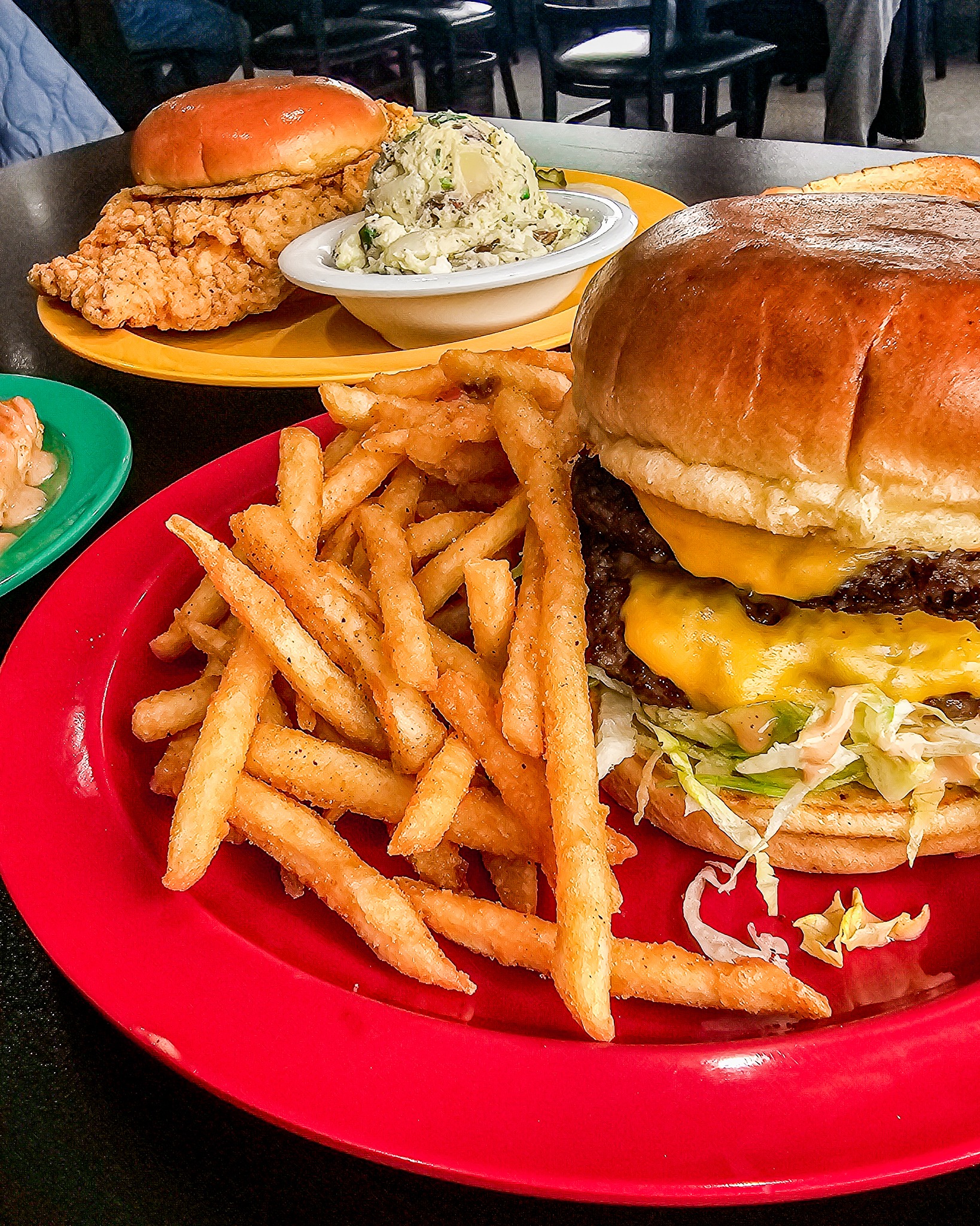Lunch in Ankeny at It’s My Jam Cafe featuring a classic cheeseburger with melted cheddar, seasoned fries, and homestyle sides, highlighting a popular Ankeny lunch favorite.
